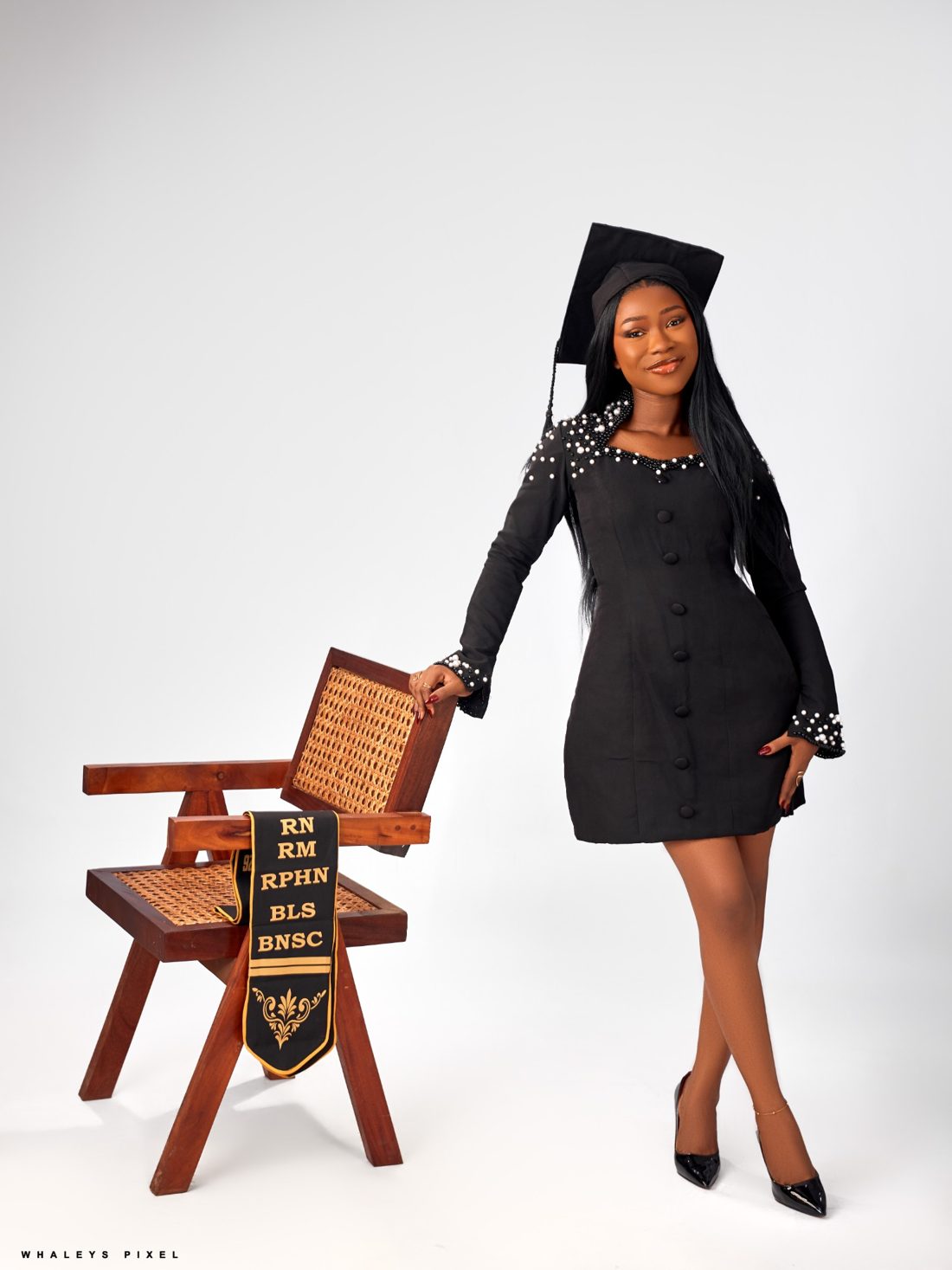 Graduation stole draped over a chair, listing RN, RM, RPHN, BLS and BNSC